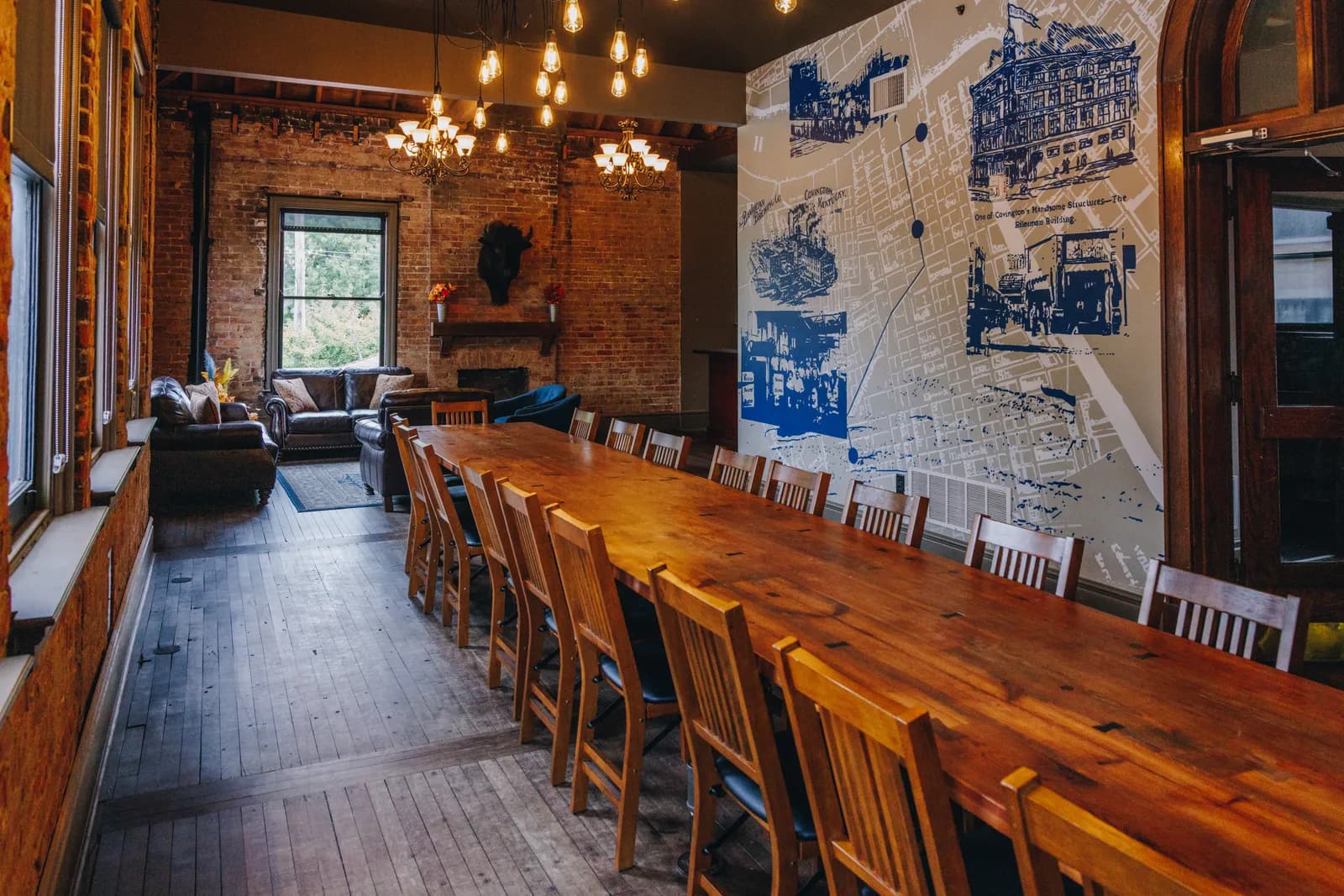 The Boardroom's long table beneath the Covington map